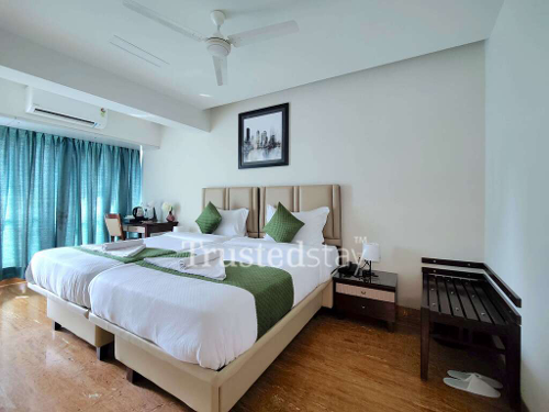 Bedroom one of MCJC House TrustedStay Service Apartment in Dadar West, Mumbai